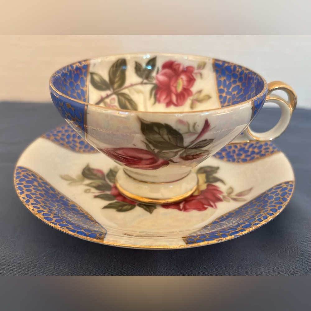 Floral Teacup and Saucer Set with Blue and Gold Accents